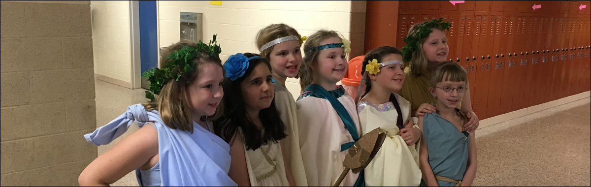 Picture of elementary students dressed for a performance of a Greek Mythology play.